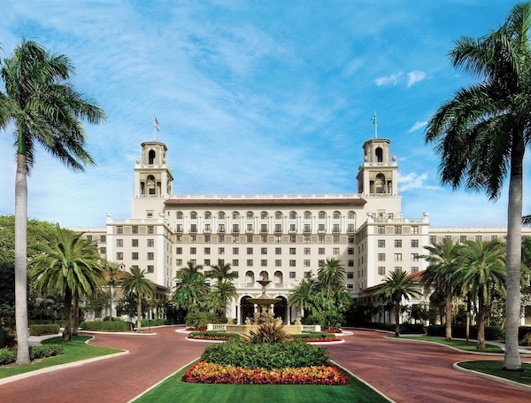 Landscaped entry to a large hotel The Breakers Palm Beach