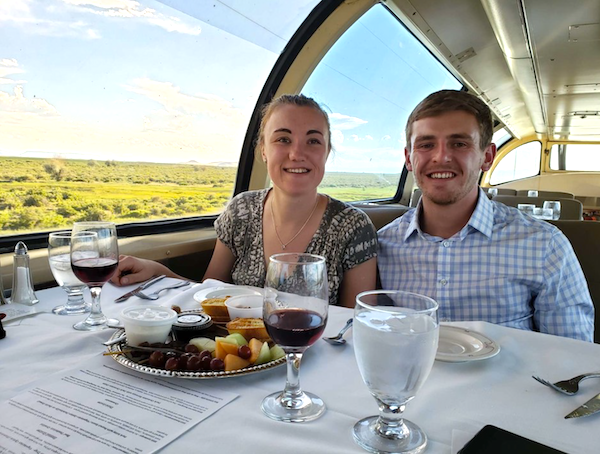 A young couple enjoying brunch on the Wine Train Colorado