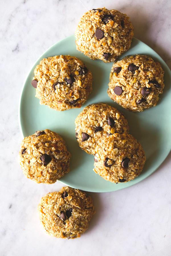 A pale green plate with several oatmeal peanut butter chocolate chip cookies from Eat Like You Give A Fork