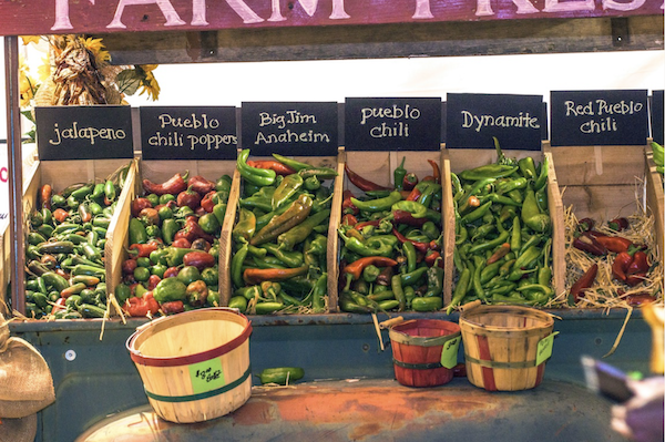 Savor The Flavors Of Fall In Colorado with crates of chiles.