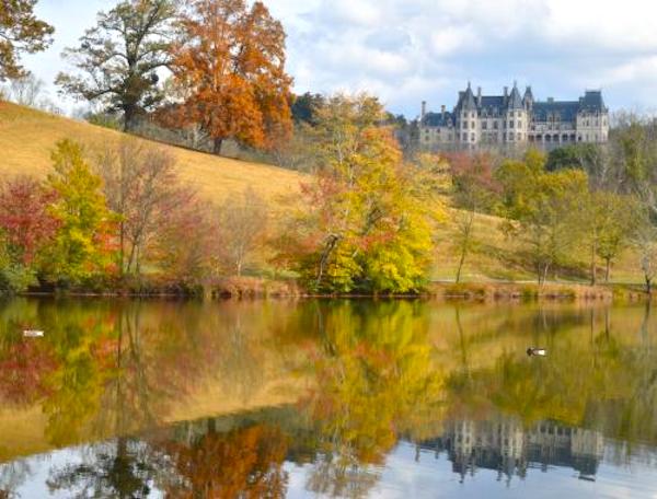 A lake, trees with autumn leaves and an estate from Fall Adventures In Asheville, NC