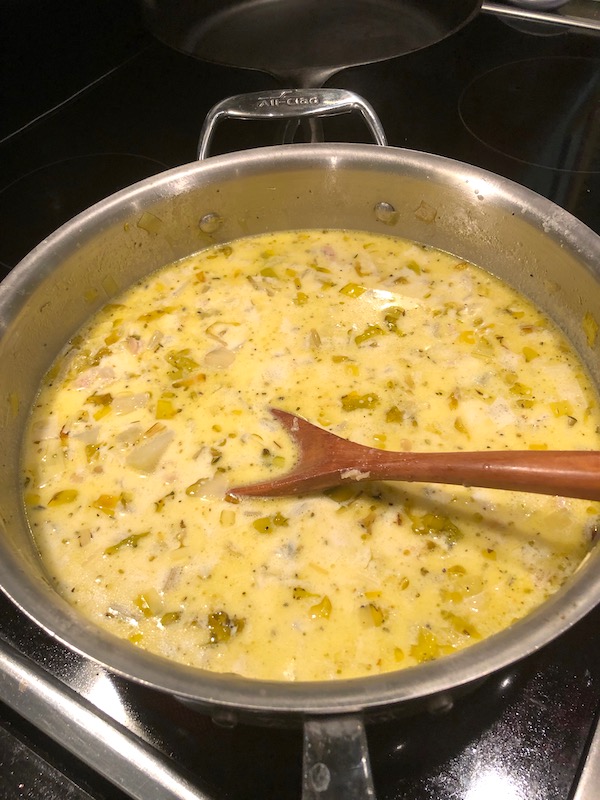 A pan with soup mixture for New England Clam Chowder