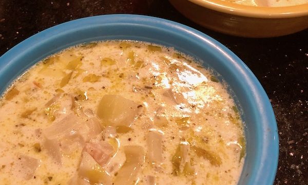 Two soup bowls filled with New England Clam Chowder.