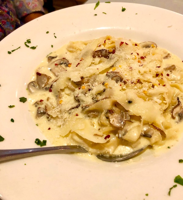 Fettuccini Funghi with porcini, shiitake, and crimini mushrooms in a light cream sauce topped with shaved imported black truffle cheese at Red Room In Ventnor NJ