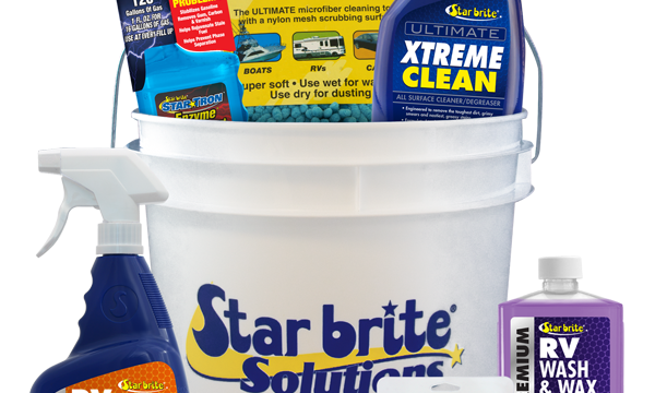 A large white bucket filled with bottles of cleaning supplies from 10 Best RV Camping Gifts