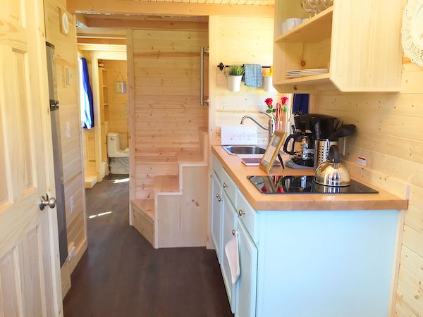A tiny house kitchen with aqua cabinets from Authentic Oktoberfest - No Passport Required