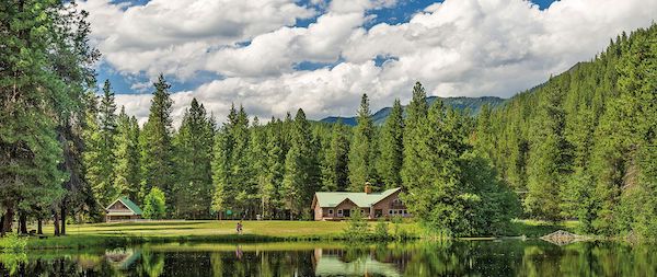 A lake with tall trees and buildings from Authentic Oktoberfest - No Passport Required