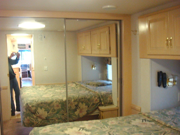 An RV bedroom with off white walls from Simple Ideas For Renovating Your RV