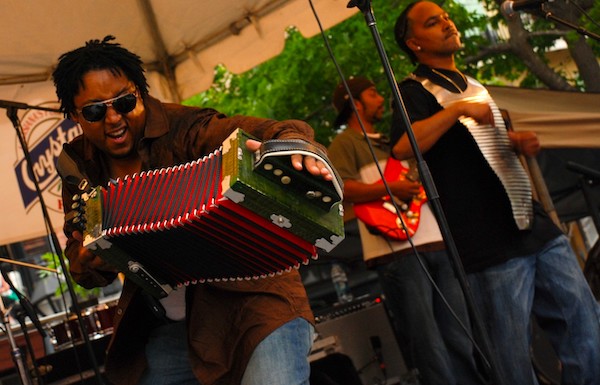 Musicians playing instruments from Beyond The Bayou
