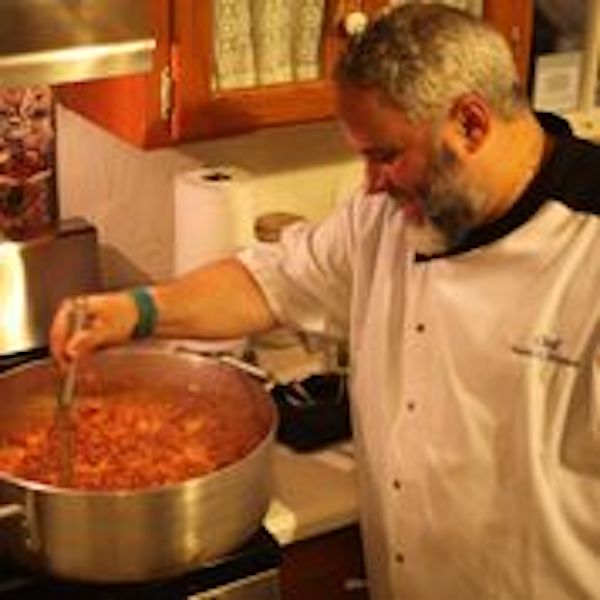 A chef stirring a pot from Beyond The Bayou