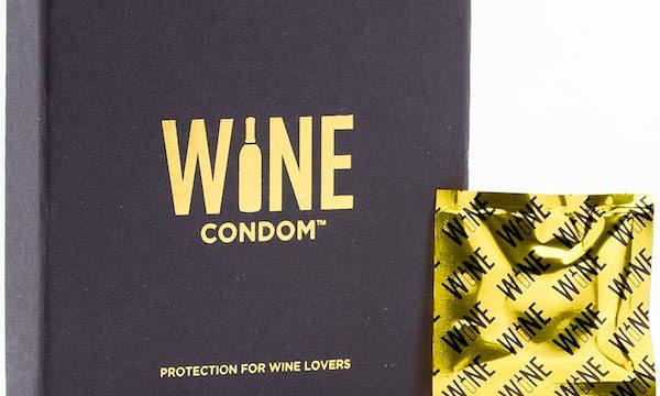 A black box with gold printing and a foil wrapped Wine Condom from Fun Thanksgiving After Party