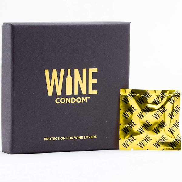A black box with gold printing and a foil wrapped Wine Condom from Fun Thanksgiving After Party