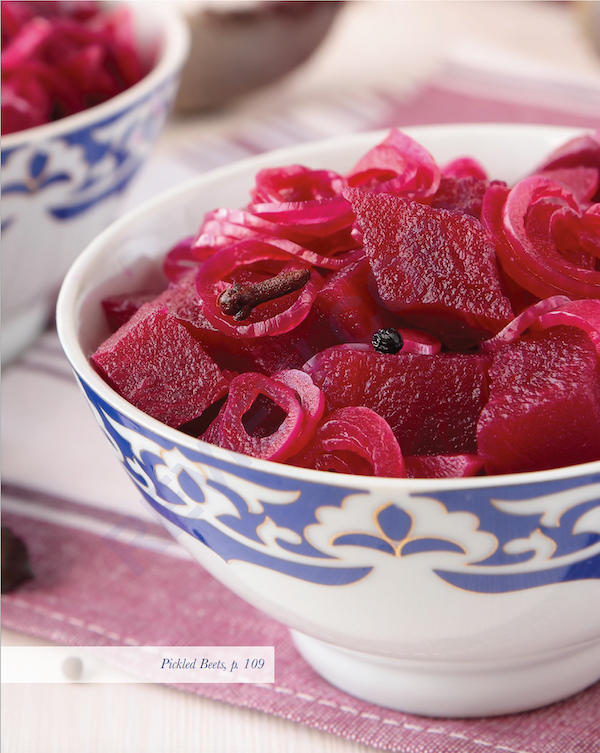 A white and blue bowl filled with pickled beets from Deep Flavors by Kenneth M. Horwitz