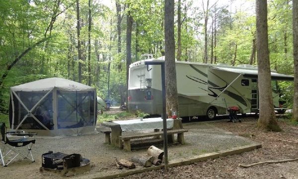 An RV at a campsite from Let the Adventure Begin!