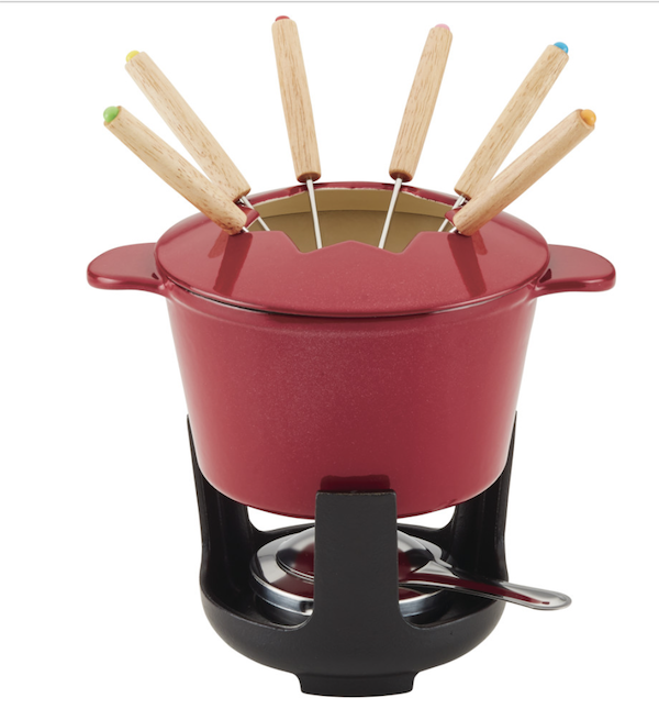 A red fondue pot with forks on a black stand is one of the Best Valentine's Gifts for Cooks