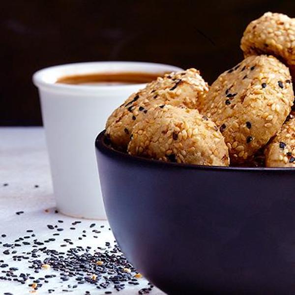 Thick cookies in a black bowl would be great after Chicken Breast Tahini Drizzled Hero for Super Bowl