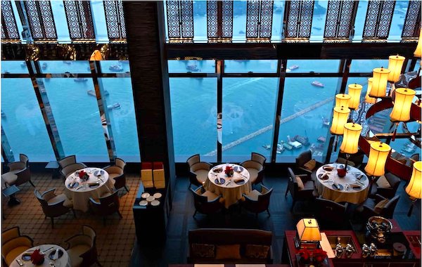 The interior of an upscale restaurant with view of the water from Hong Kong Food City