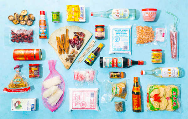 A variety of Asian ingredients laid out on an aqua background from Hong Kong Food City