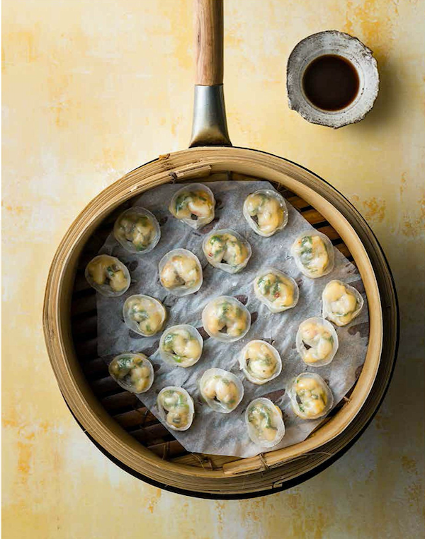 A bamboo steamer filled with small scallop and chive dumplings from Hong Kong Food City