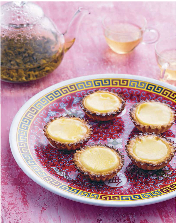 A plate of tiny pale yellow custard tarts from Hong Kong Food City