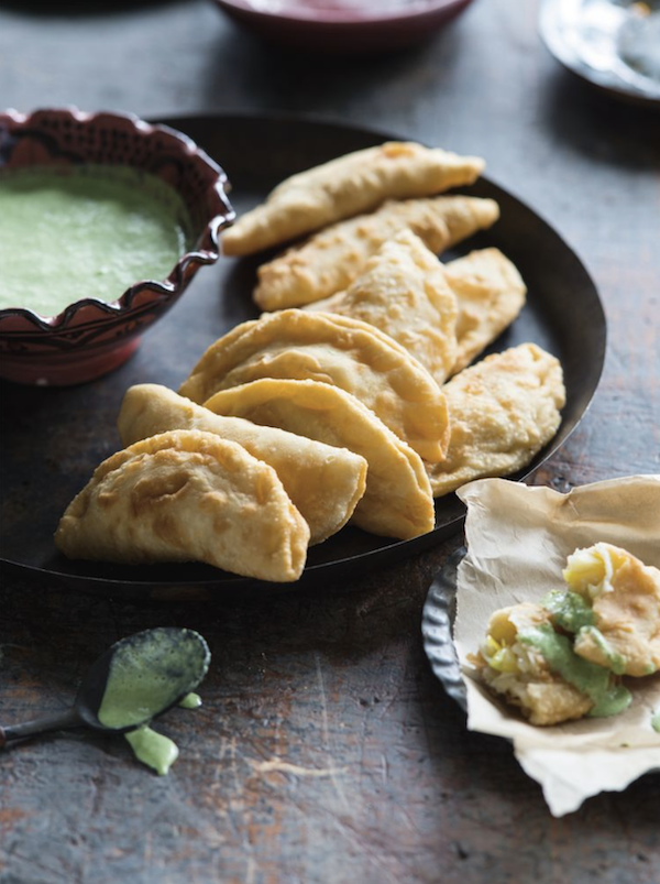 Flaky half moon shaped pastries with a creamy green sauce from Lands of the Curry Leaf by Peter Kuruvita