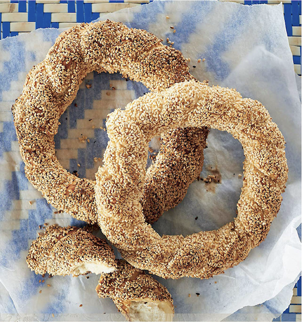 Round pastries covered in sesame seeds from Anatolia Adventures in Turkish Eating showing a photo of round sesame covered pastries.