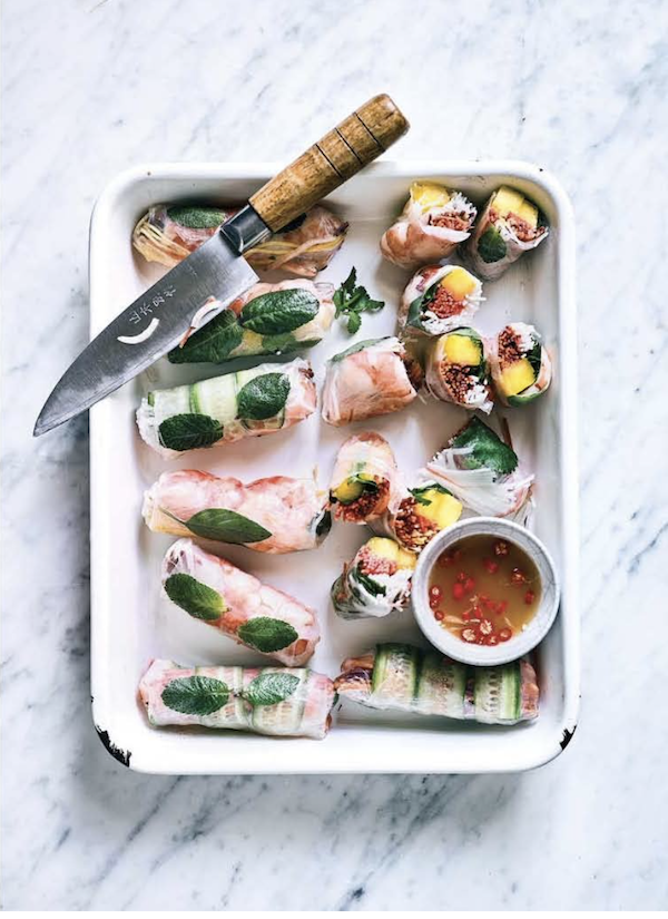 A white platter topped with rice paper rolls and sauce from My Asian Kitchen