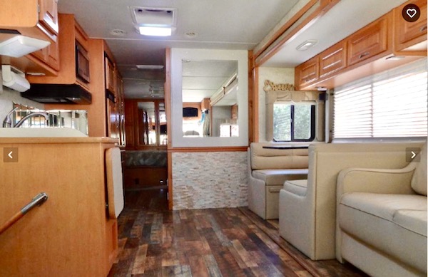 An RV living area with hardwood floors from Our RV Renovations Update