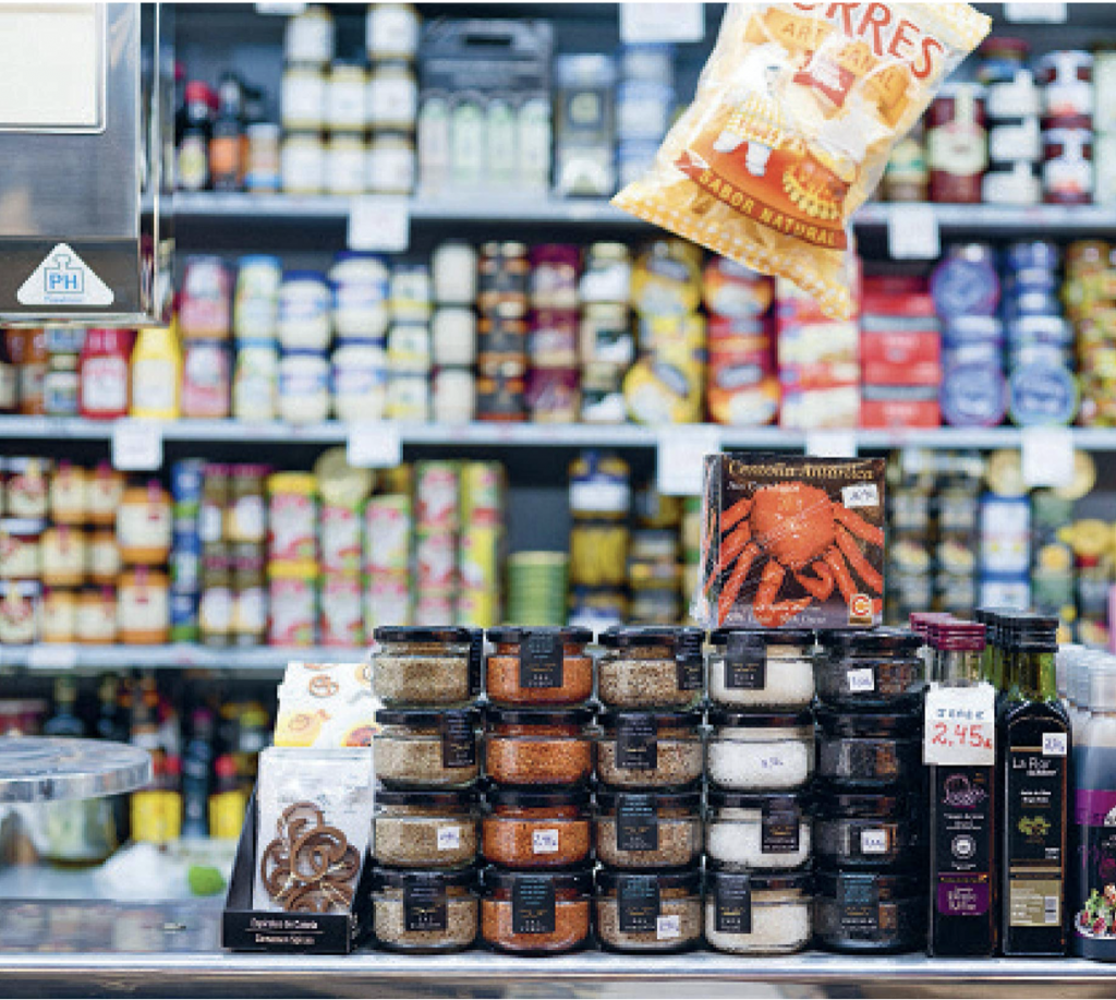 An array of food stacked on shelves and counters from Barcelona Cult Recipes