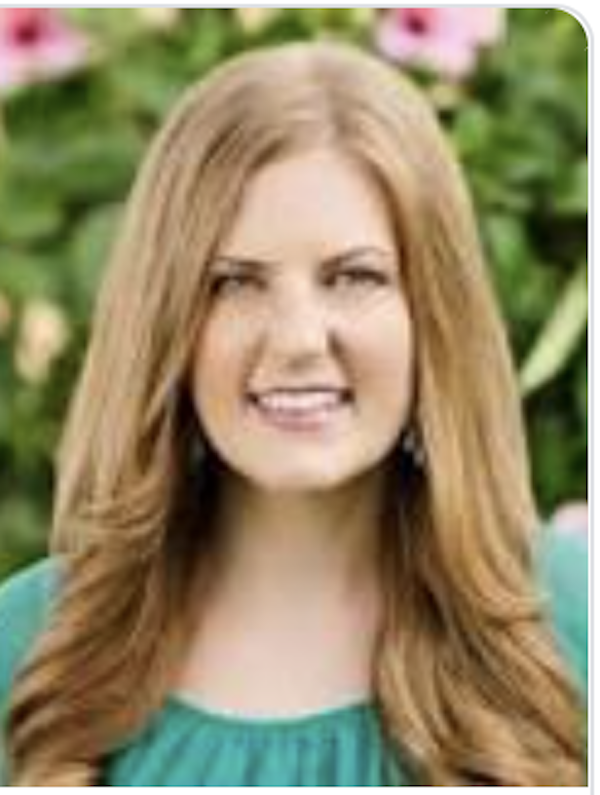 A woman with long hair is Erika Hueneke author of Complete Guide to the National Parks