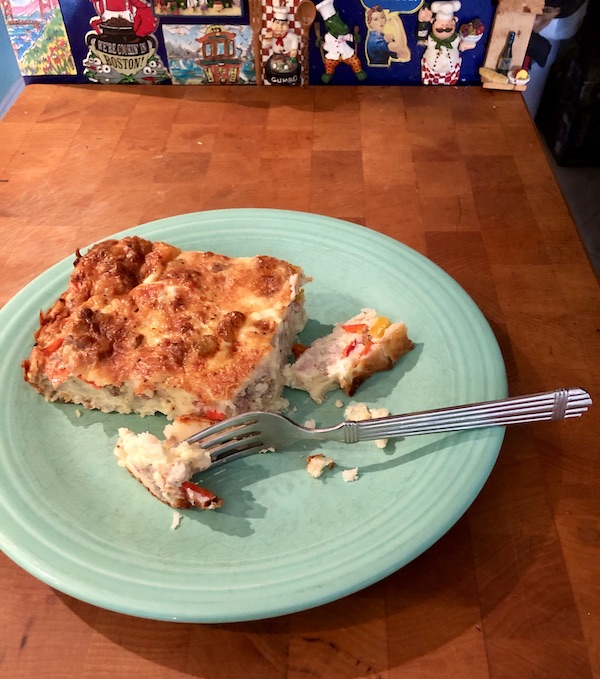A mint green plate topped with a portion of my Easy Breakfast for Dinner Casserole