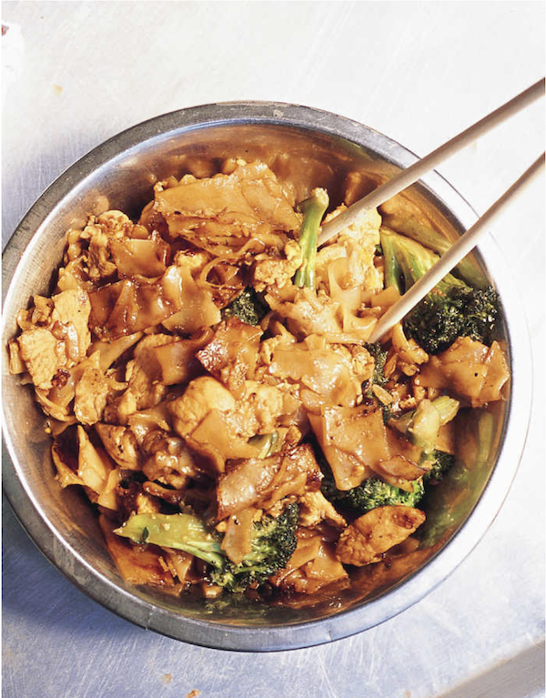 A metal bowl filled with chicken, broccoli and rice noodles from Los Angeles Cult Recipes