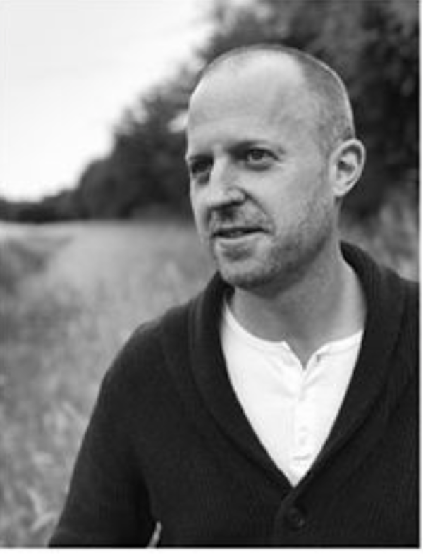 A black and white photo of a man in front of a river from Taste the Wild
