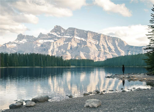 Snowy mountains reflected in a lake from Taste the Wild