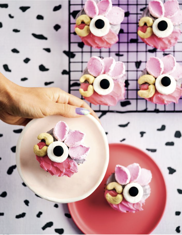 Plates and cooling rack topped with pink parrot cupcakes from Bake Australia Great
