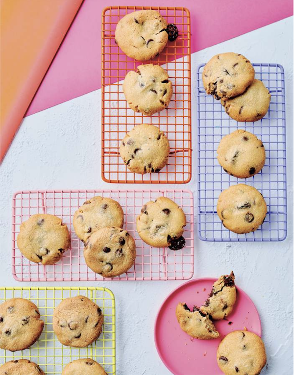 Pink and blue cooling racks topped with chocolate chip cookies from Bake Australia Great