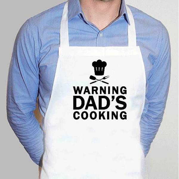 A man in a blue shirt with a white apron from Father's Day Gifts for Dads who cook