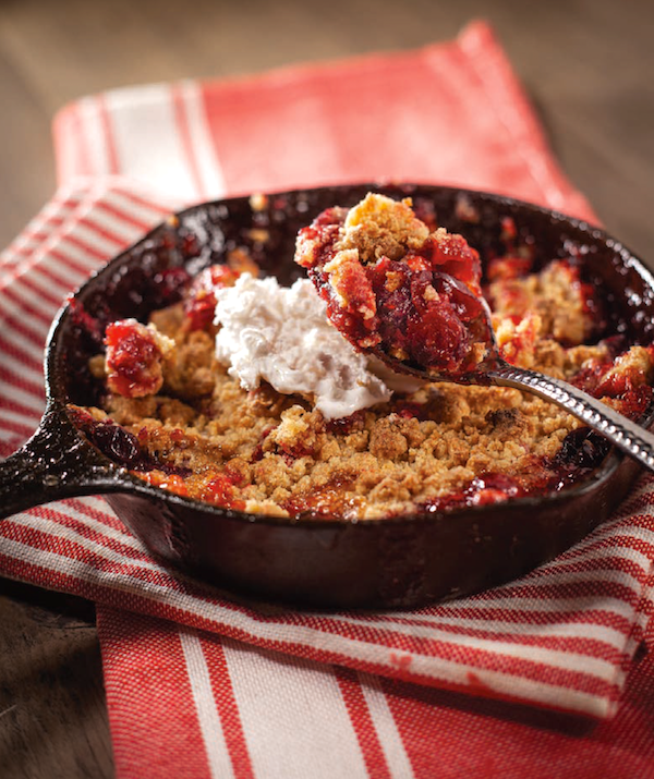 A fruit cobbler in a cast iron pan from My Pinewood Kitchen