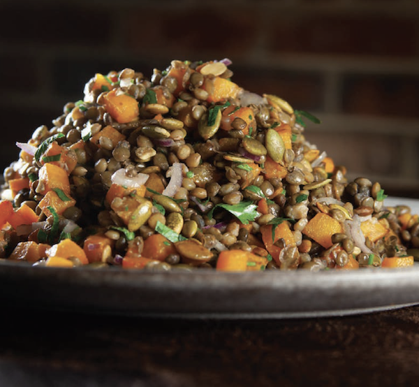 A dish piled high with butternut squash and lentils from My Pinewood Kitchen