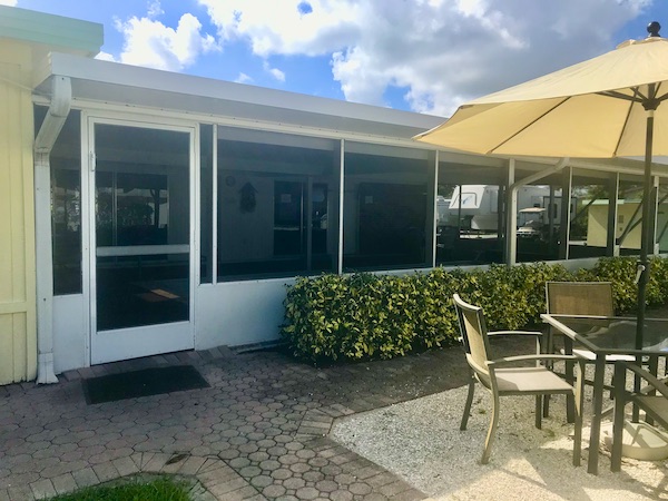 A screened in room with patio in front from Living Our Dream