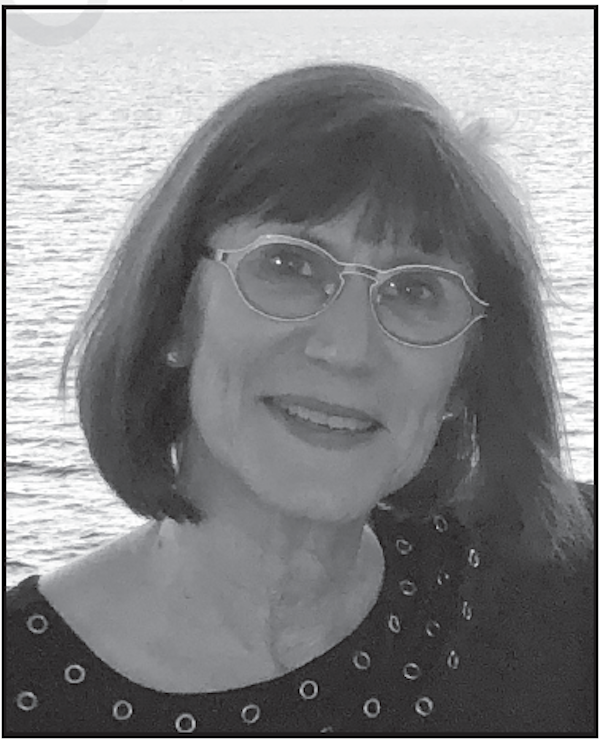 A black and white photo of a woman with dark hair from TV Dinners
