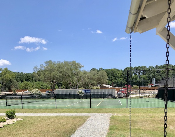 Fenced in tennis courts at CreekFire RV Resort Savannah