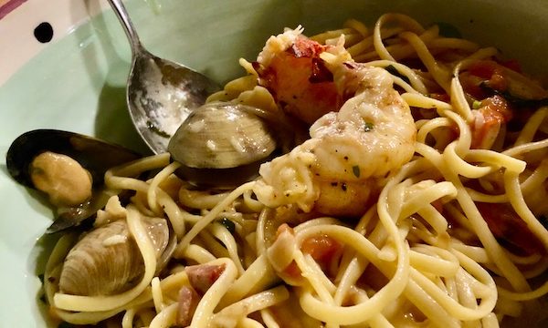 A large bowl filled with pasta and seafood from Francesco's Ristorante