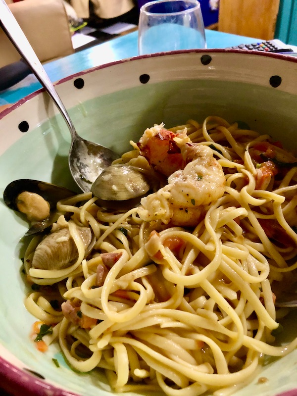 A large bowl filled with pasta and seafood from Francesco's Ristorante
