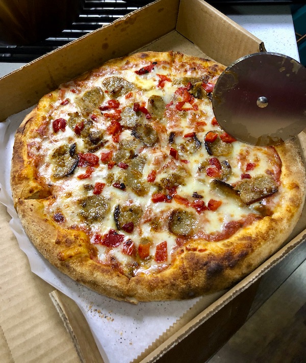 A sausage pizza with roasted red pepper from Francesco's Ristorante
