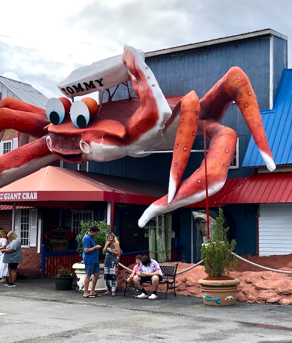 A blue building with a giant crab on the front from Grillin' and Chillin' in North Myrtle Beach