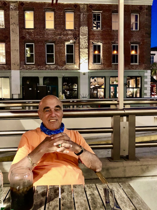 A man in an orange T-shirt at Little Duck Diner, Savannah 