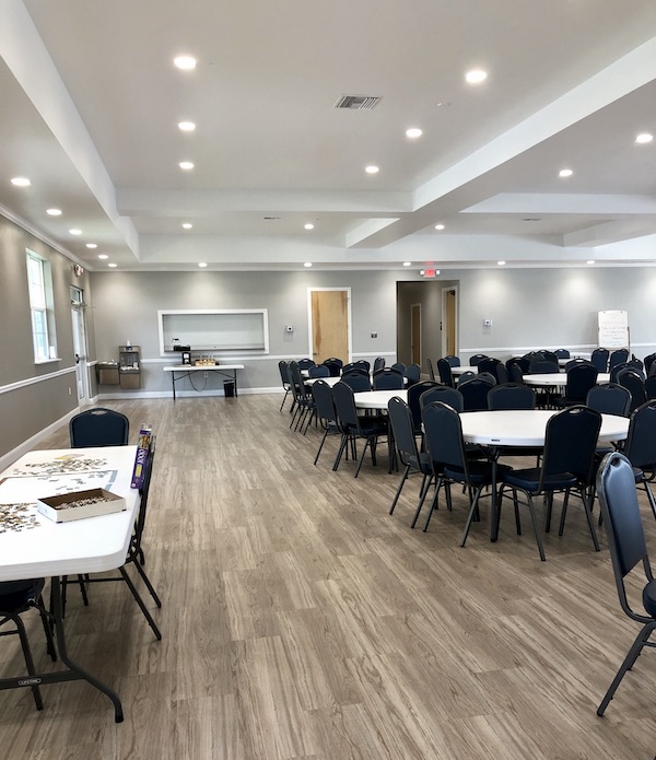 A banquet room with wood floors at Sunkissed Village RV Resort