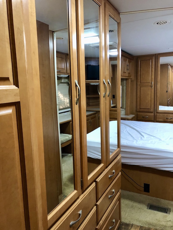 Closets with light wood trim and mirrors from RV Renovations Complete The Big Reveal
