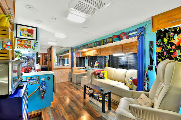 An RV living area with wood floors from RV Renovations Complete The Big Reveal